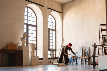 Young white woman painter in an art studio