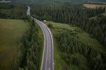 Fototapeta na wymiar Aerial view on mountain road from drone