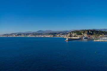 City of Nice in France, pier on Mediterranean Sea with Phare de Nice lighthouse on French Riviera