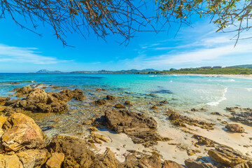 Rocks and turquoise water in Rena Bianca beach in Costa Smeralda