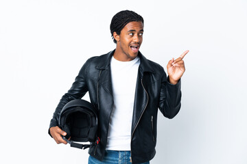 African American man with braids holding a motorcycle helmet isolated on white background intending to realizes the solution while lifting a finger up