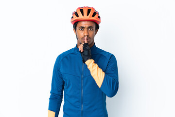 Young cyclist man with braids over isolated background showing a sign of silence gesture putting finger in mouth