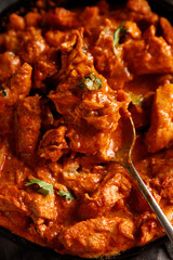Close up chicken paprikash dish with paprika onion bulgarian paper on pan on dart table for dinner
