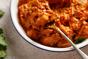 Chicken paprikash dish with paprika onion bulgarian paper on plate on light table for dinner