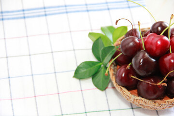 red cherry fruits with a green stalk