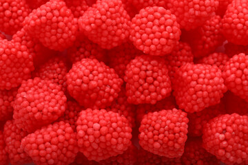 Delicious gummy raspberry candies as background, top view © New Africa