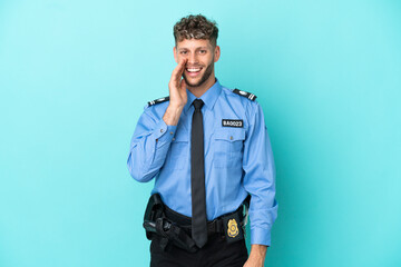 Young police blonde man isolated white on blue background shouting with mouth wide open