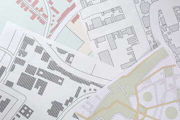 Fototapeta premium Many different cadastral maps of territory with buildings as background, top view