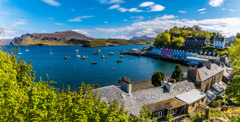 Naklejka premium A view over the town of Portree on the Isle of Skye, Scotland on a summers day