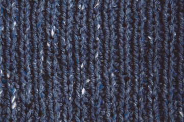 Texture beautiful knitted blue fabric with metallic fibers as background
