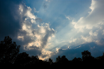 Clouds and sunrays in the sky