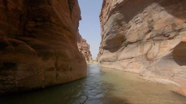 Canyoning. Passing the canyon of a mountain river without boats in Jordan.