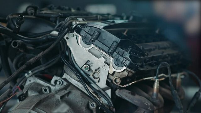 car engine repair in a car service, valve cover and gasket replacement.