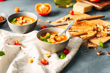 Tomato soup. Tomato creme with basil and bread.  Bowl with italian tomato soup. 