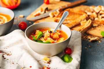 Tomato soup. Tomato creme with basil and bread.  Bowl with italian tomato soup. 