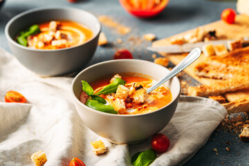 Tomato soup. Tomato creme with basil and bread.  Bowl with italian tomato soup. 