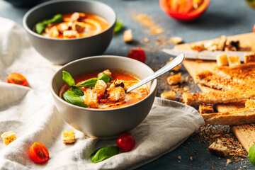 Tomato soup. Tomato creme with basil and bread.  Bowl with italian tomato soup. 