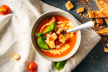 Tomato soup. Tomato creme with basil and bread.  Bowl with italian tomato soup. 