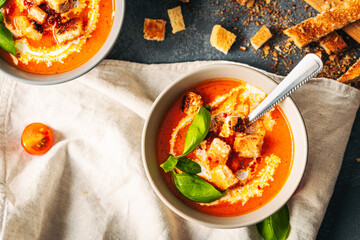 Tomato soup. Tomato creme with basil and bread.  Bowl with italian tomato soup. 