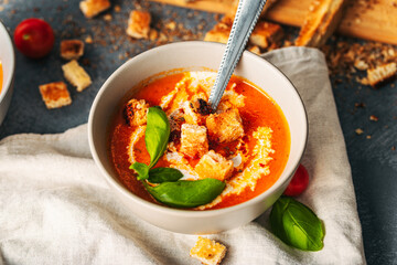 Tomato soup. Tomato creme with basil and bread.  Bowl with italian tomato soup.  © Exploder