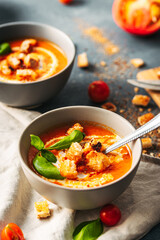 Tomato soup. Tomato creme with basil and bread.  Bowl with italian tomato soup. 