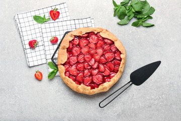 Composition with tasty strawberry pie on grey background