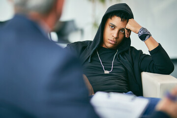 African American teenager on meeting with psychotherapists at counselling center.