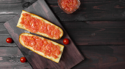 Toast with tomato, traditional Spanish breakfast. Olive oil, top view. Pan tumaka