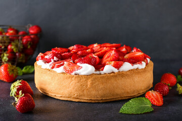 Tasty strawberry pie on dark background