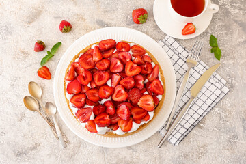 Composition with tasty strawberry pie on light background