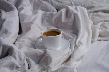 Coffee with milk in bed. Breakfast in bed. Interior. Cosiness.