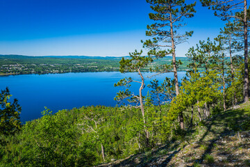 View on the blue waters of Lake Temiscouata from the Montagne du Fourneau, a small mountain located in the Temiscouata National Park in Bas Saint Laurent region of Quebec (Canada)