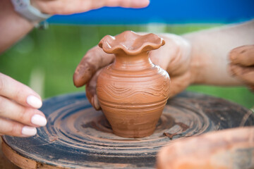 Fototapeta na wymiar workshop of ukrainian traditional handmade ceramic pots on the wheel