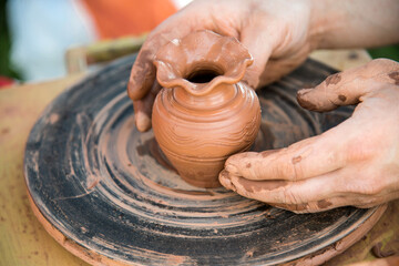 workshop of ukrainian traditional handmade ceramic pots on the wheel