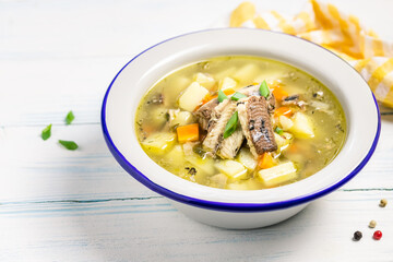 Traditional ukha, fish soup in a bowl on wooden background. Space for text.