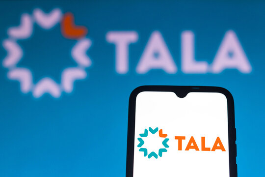 July 27, 2021, Brazil. In this photo illustration the Tala logo is seen on a smartphone and a pc screen.