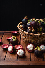 Mangosteen fruit on wooden background