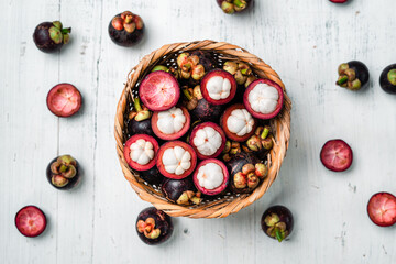 Mangosteen fruit on white wooden background