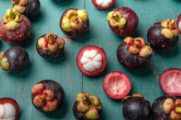 Mangosteen fruit on light blue wooden background