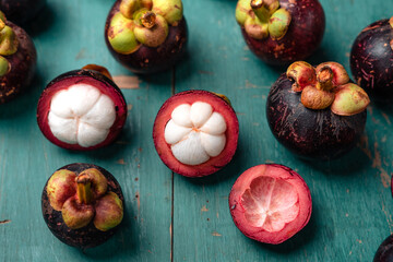 Mangosteen fruit on light blue wooden background