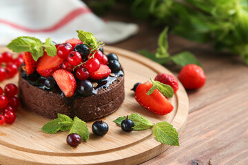 Chocolate tart with berries and mint