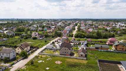 Fototapeta na wymiar Aerial view of a village in Ukraine with houses and country roads