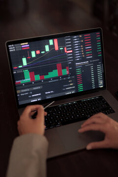 Crop broker working on laptop and trading online