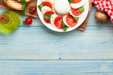 Caprese salad with mozzarella, basil and garden tomatoes