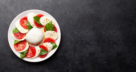 Caprese salad with mozzarella, basil and garden tomatoes