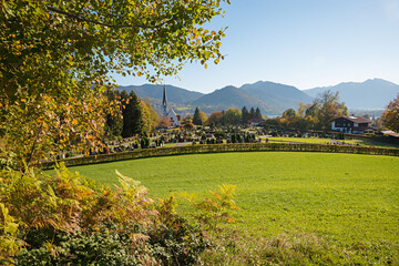 view over Bad Wiessee cemetary and church, bavarian alps in autumn