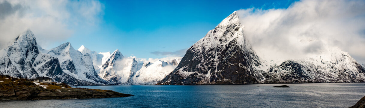 Landscape panorama in Norway, mountains with snow - capped peaks