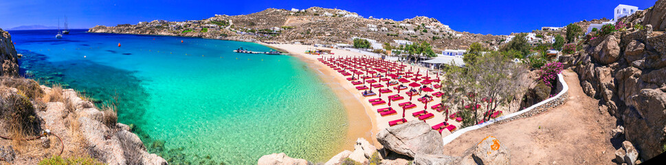 Greece summer holidays. Cyclades .Most famous and beautiful beaches of Mykonos island - Super Paradise beach with crystal celar waters - obrazy, fototapety, plakaty
