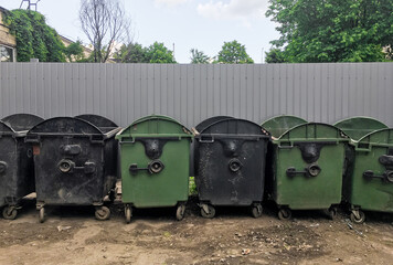 trash containers on the street. dump. waste.