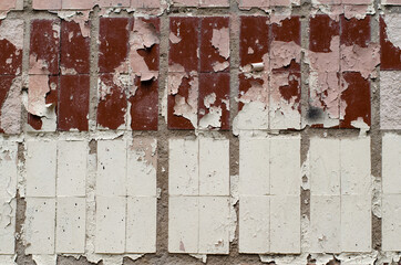 Ceramic tile. Old peeling paint on the wall. Vintage wall. Mosaic.
